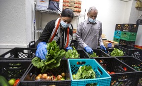 Fort York Food Bank volunteers Amina Maryam and her father Muhammad Akram at 380 College St. in Toronto on Wednesday, April 5, 2023. ERNEST DOROSZUK/TORONTO SUN