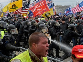 In this file photo taken on Jan. 6, 2021 Trump supporters clash with police and security forces as people try to storm the U.S. Capitol in Washington D.C.