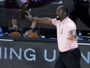 Assistant coach Adrian Griffin of the Toronto Raptors reacts during first-half action against the Philadelphia 76ers after head coach Nick Nurse stepped down for the night to let Griffin coach at The Field House at ESPN Wide World Of Sports Complex on August 12, 2020 in Lake Buena Vista, Florida.