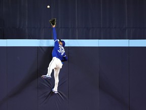 Kevin Kiermaier #39 of the Toronto Blue Jays catches a ball at the wall hit by Kerry Carpenter #30 of the Detroit Tigers for the first out of the second inning at Rogers Centre on April 11, 2023 in Toronto.  (Photo by Vaughn Ridley/Getty Images)