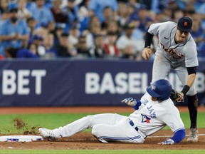 Ryan Kreidler of the Detroit Tigers tags out Matt Chapman of the Toronto Blue Jays at third base as he tries to take third on a Daulton Varsho of the Toronto Blue Jays single in the sixth inning of their MLB game at Rogers Centre on April 12, 2023 in Toronto, Canada.