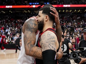 DeMar DeRozan of the Bulls hugs Fred VanVleet  of the Raptors after Chicago rallied to defeat Toronto in their NBA play-in game at Scotiabank Arena on April 12, 2023.