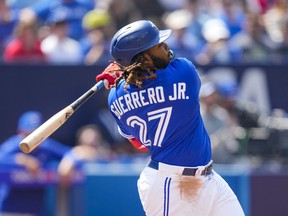 Vladimir Guerrero Jr. of the Toronto Blue Jays hits an RBI single against the Tampa Bay Rays in the first inning during their MLB game at the Rogers Centre on April 16, 2023 in Toronto, Ontario, Canada.