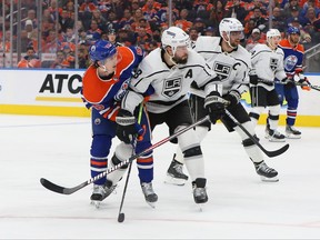 Drew Doughty of the Los Angeles Kings battles with Kailer Yamamoto of the Edmonton Oilers in overtime in Game One of the First Round of the 2023 Stanley Cup Playoffs on April 17, 2023 at Rogers Place in Edmonton, Alberta, Canada.