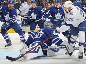 Nicholas Paul of the Tampa Bay Lightning skates the puck against goaltender Joseph Woll of the Toronto Maple Leafs during Game One of the First Round of the 2023 Stanley Cup Playoffs at Scotiabank Arena on April 18, 2023 in Toronto, Ontario, Canada.