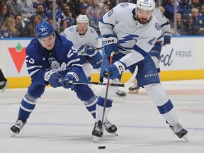 Leafs rookie winger Matthew Knies, playing in his first playoff game and his first game at Scotiabank Arena, takes a penalty against Tampa Bay’s Nick Paul last night.
