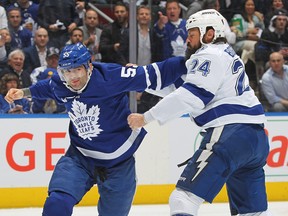 Zach Bogosian #24 of the Tampa Bay Lightning fights Mark Giordano #55 of the Toronto Maple Leafs in Game Two of the First Round of the 2023 Stanley Cup Playoffs at Scotiabank Arena on April 20, 2023 in Toronto. (Photo by Claus Andersen/Getty Images)