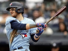 Danny Jansen of the Toronto Blue Jays hits into a run scoring fielders choice against the New York Yankees during the ninth inning at Yankee Stadium on April 23, 2023 in the Bronx borough of New York City. The Blue Jays won 5-1.  Photo by /)