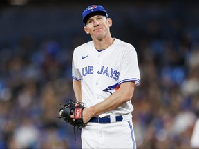 Blue Jays starter Chris Bassitt looks on disbelieving after walking a batter in the first inning yesterday at the Rogers Centre. After giving up four runs in the first, Bassitt took his frustrations out on a tablet in the Jays dugout.