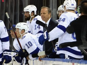 Head coach Jon Cooper of the Tampa Bay Lightning handles the bench.