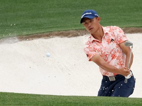 Collin Morikawa of the United States plays a shot from a bunker on the 15th hole during the first round of the 2023 Masters Tournament at Augusta National Golf Club on April 06, 2023 in Augusta, Georgia.