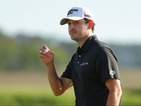 Patrick Cantlay of the United States waves.
