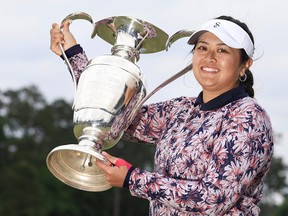 Lilia Vu of the United States celebrates with the trophy after winning in a one-hole playoff during the final round of The Chevron Championship at The Club at Carlton Woods on April 23, 2023 in The Woodlands, Texas.