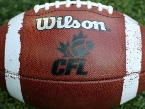 A CFL logo on an official Canadian CFL league ball during warm-ups before the Saskatchewan Roughriders CFL game against the Toronto Argonauts on July 11, 2013 at Rogers Centre in Toronto, Ontario, Canada.