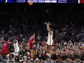 San Diego State guard Lamont Butler scores the game winning basket against Florida Atlantic in a Final Four college basketball game in the NCAA Tournament on Saturday, April 1, 2023, in Houston.