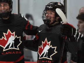 Canada forward Sarah Fillier celebrates her goal with teammate Natalie Spooner during third period IIHF women's world hockey championship  action in Brampton, Ont., on Wednesday, April 5, 2023.