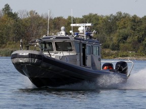 Border Patrol Agents patrol the Niagara River near the international border with Canada in Buffalo, N.Y. on Oct.6, 2011. A U.S. law enforcement agency says three Mexican migrants have been sent back to Canada after they attempted to cross into New York state on a rail bridge from Ontario.