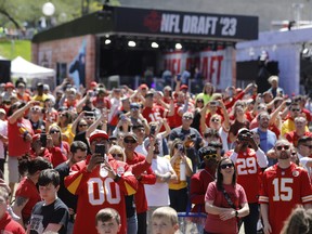 Kansas City Chiefs fans watch their team's fifth round draft selection.