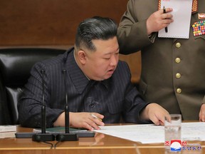 This photo taken on April 10, 2023 and released by North Korea's official Korean Central News Agency (KCNA) on April 11 shows North Korean leader Kim Jong Un attending the 6th Enlarged Meeting of the 8th Central Military Commission of the Workers' Party of Korea (WPK) at the office building of the WPK Central Committee in Pyongyang.