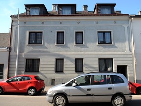 A car drives past the house of Josef Fritzl, an Austrian father who imprisoned and raped his daughter in a cellar for 24 years, in Amstetten on March 4, 2009.