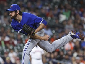 Apr 18, 2023; Houston, Texas, USA; Toronto Blue Jays relief pitcher Jordan Romano (68) delivers a pitch during the ninth inning against the Houston Astros at Minute Maid Park.