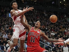 Feb 28, 2023; Toronto, Ontario, CAN; Chicago Bulls forward DeMar DeRozan (11) reacts after having a shot blocked by Toronto Raptors forward Scottie Barnes (4) during the second half at Scotiabank Arena.