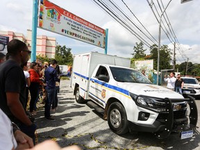 A car with forensic technicians leaves a pre-school after a 25-year-old man attacked children, killing several and injuring others, in Blumenau, Brazil April 5, 2023.