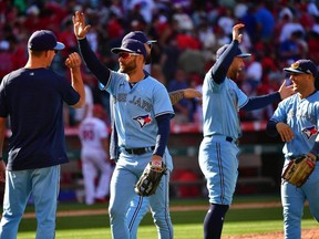 Blue Jays centre fielder Kevin Kiermaier (second left) celebrates the victory against the Angels at Angel Stadium in Anaheim, Calif., Sunday, April 9, 2023.
