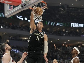 Brook Lopez of the Milwaukee Bucks dunks the ball against the Miami Heat during the first half of Game One of the Eastern Conference First Round Playoffs at Fiserv Forum on April 19, 2023 in Milwaukee, Wisc.