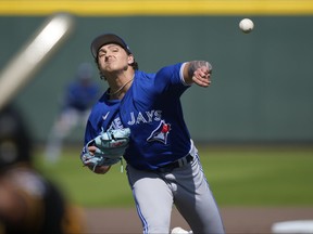 Blue Jays pitcher Ricky Tiedemann throws in the fifth inning of a spring training game against the Pittsburgh Pirates in Bradenton, Fla., Tuesday, March 7, 2023.