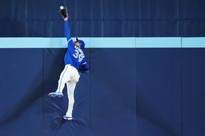 Blue Jays centre fielder Kevin Kiermaier makes a leaping catch to save a home run off the bat of Detroit Tigers designated hitter Kerry Carpenter during second inning. NATHAN DENETTE/THE CANADIAN PRESS