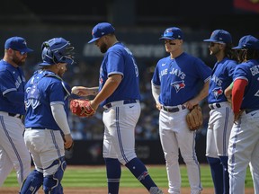 Blue Jays starting pitcher Alek Manoah is visited at the mound and being subbed out during the fifth inning against the Tampa Bay Rays in Toronto on Sunday, April 16, 2023.