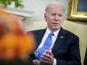 President Joe Biden speaks in the Oval Office of the White House, Monday, April 24, 2023, in Washington, as he and Vice President Kamala Harris meet with the three Tennessee state lawmakers who faced expulsion for participating in gun control protests at their statehouse. (AP Photo/Andrew Harnik)