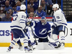 Maple Leafs' Alex Kerfoot  tips in the game-winning goal past Tampa Bay Lightning goaltender Andrei Vasilevskiy during overtime in Game 4 on Monday.
