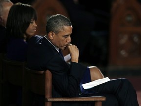 President Barack Obama and first lady Michelle Obama attend an interfaith healing service at the Cathedral of the Holy Cross in Boston, Thursday, April 18, 2013, for victims of the Boston Marathon bombing. THE ASSOCIATED PRESS FILES