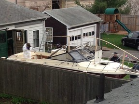 Investigators work near the location, on Saturday, April 20, 2013, in Watertown, Mass., where the previous night a suspect in the Boston Marathon bombings was arrested. THE ASSOCIATED PRESS FILES