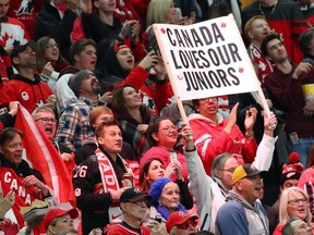 Fans cheer for Canada in the second period against Sweden during the gold medal game of the IIHF World Junior Championship at KeyBank Center in Buffalo, N.Y., Jan. 5, 2018.