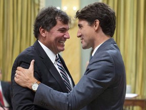 Prime Minister Justin Trudeau shakes hands with Dominic LeBlanc, Minister of Intergovernmental and Northern Affairs and Internal Trade, during a swearing in ceremony at Rideau Hall in Ottawa on July 18, 2018. THE CANADIAN PRESS/Justin Tang