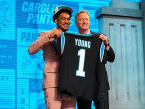 Apr 27, 2023; Kansas City, MO, USA; Alabama quarterback Bryce Young with NFL commissioner Roger Goodell after he was drafted first overall by the Carolina Panthers in the first round of the 2023 NFL Draft at Union Station.