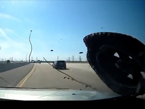 Loose pickup truck wheel smashes into car’s windshield on highway. A screenshot of a  video posted to twitter on Monday April 17, 2023, by OPP Highway Safety Division. Twitter/@OPP_HSD,