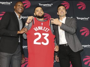 Fred VanVleet along with president Masai Ujiri and general manager Bobby Webster (R) in Toronto, Ont. on Friday July 6, 2018.