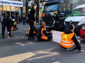 Last generation activists block a road amid a protest in Berlin, Germany April 28, 2023.