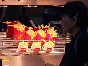 McDonald's french fries sit under a heat lamp during a one-day hiring event at a McDonald's restaurant on April 19, 2011 in San Francisco, California. (Photo by Justin Sullivan/Getty Images)