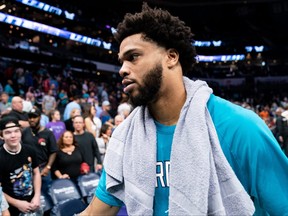 Miles Bridges of the Charlotte Hornets walks off the court after defeating the Orlando Magic during their game at Spectrum Center on April 07, 2022 in Charlotte, North Carolina.