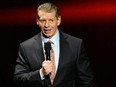 Vince McMahon speaks at a news conference.