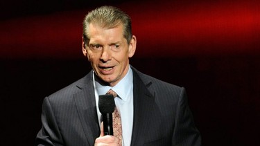 Vince McMahon speaks at a news conference.