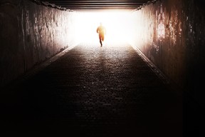 Man running through the tunnel in the sun
