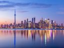 Toronto skyline with purple light.