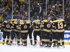 The Bruins celebrate after defeating the Washington Capitals at TD Garden in Boston on Tuesday, April 11, 2023.