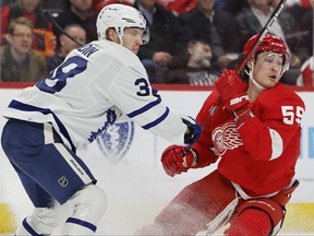 Jan 12, 2023; Detroit, Michigan, USA; Detroit Red Wings left wing Tyler Bertuzzi skates defended by Toronto Maple Leafs defenseman Rasmus Sandin in the second period at Little Caesars Arena.